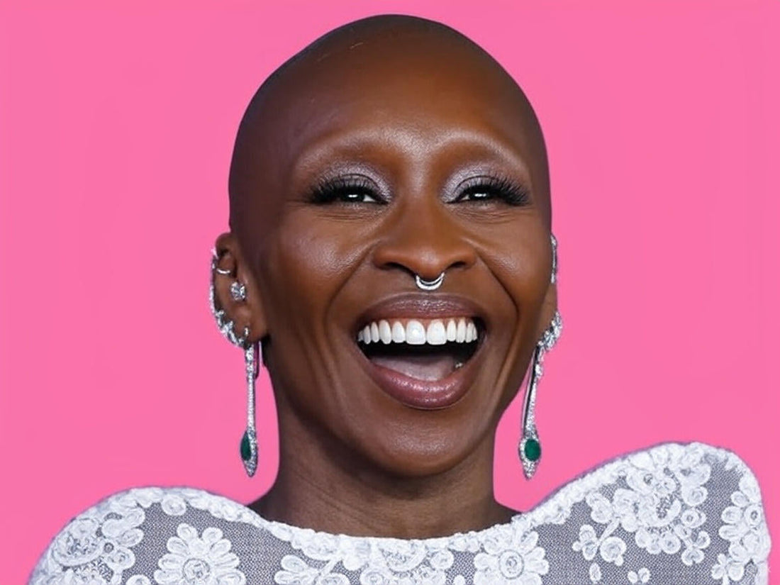 Viral moment of Cynthia Erivo with a fan, celebrating the return of her custom Schiaparelli hat